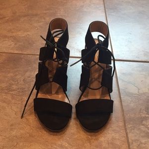 Strapped black sandals.